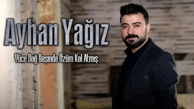Ayhan Yağız – Yüce Dağ Başında Üzüm Kol Atmış Şarkı Sözleri