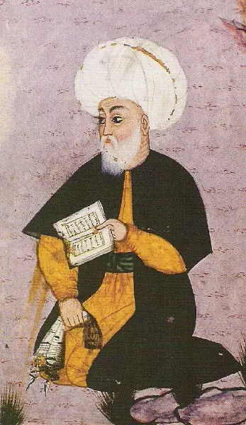 Fuzûlî'yi beyaz kavuk ve sarı-siyah kaftanla, elinde açık bir kitapla oturur hâlde gösteren 16. yüzyıl minyatürü