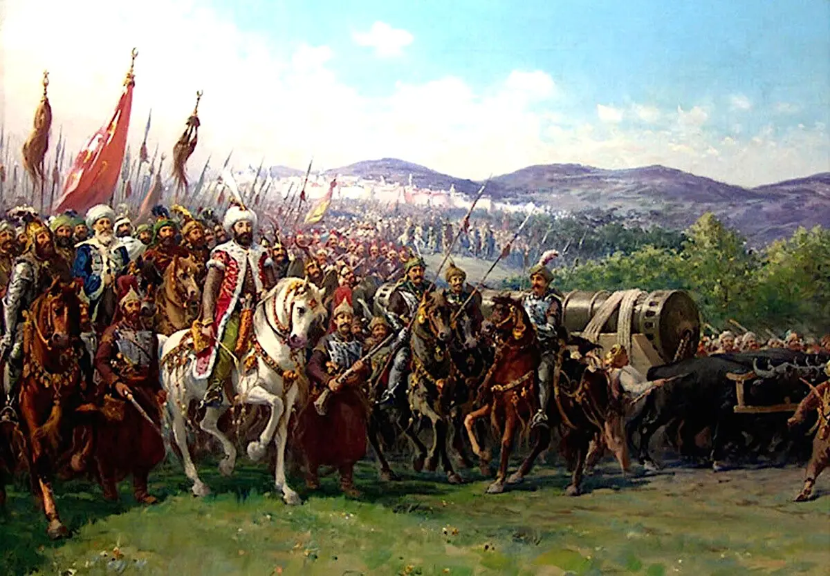 Fausto Zonaro’nun tablosu: beyaz atlı Fatih Sultan Mehmed, sancaklar taşıyan ordusu ve öküzlerin çektiği büyük topla İstanbul’a doğru ilerlerken