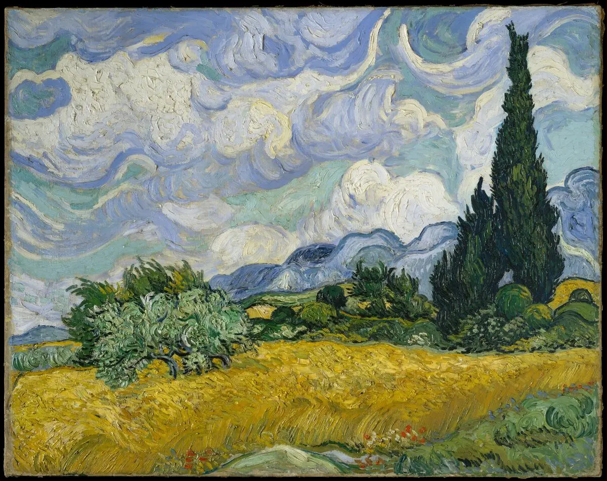 Van Gogh’un Servili Buğday Tarlası tablosu: Rüzgârla dalgalanan sarı buğday tarlası, sağda koyu yeşil, alev biçimli yüksek bir servi ağacı, arkada mavi tepeler ve kıvrımlı beyaz bulutlarla dolu gökyüzü