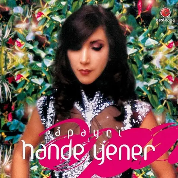 Hande Yener’in Apayrı albüm kapağı; renkli çiçekler ve yeşil yapraklar arasında başını hafifçe eğmiş koyu saçlı Hande Yener, altta pembe harflerle adı