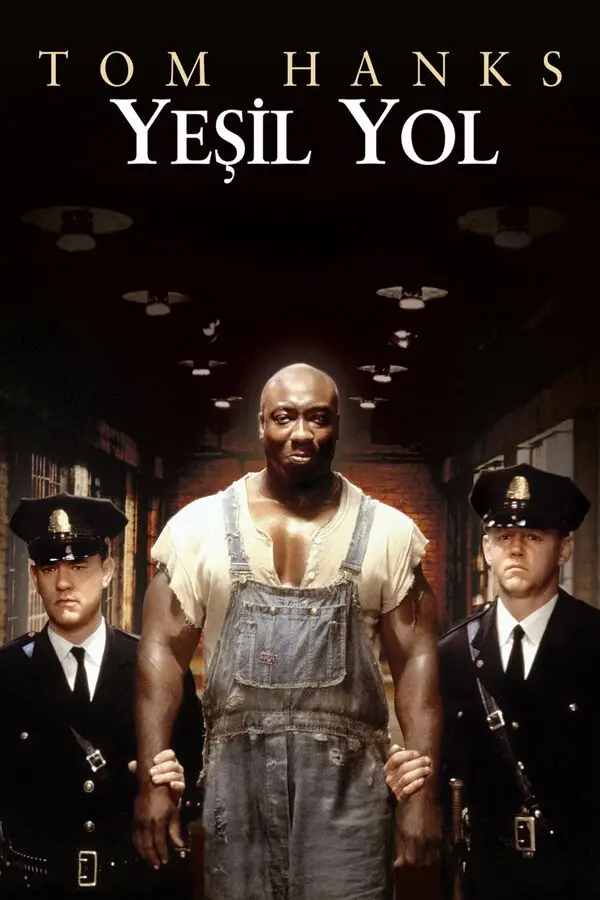Yeşil Yol filminin Türkçe afişi: üstte TOM HANKS ve YEŞİL YOL yazısı, ortada tulumlu iri yarı John Coffey (Michael Clarke Duncan) ve iki yanında üniformalı gardiyanlar