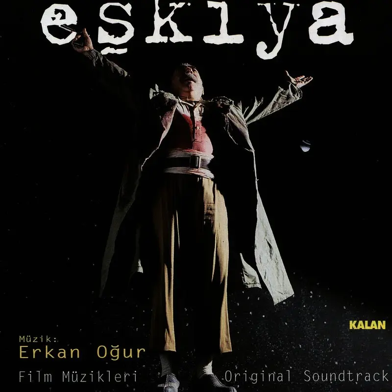 Erkan Oğur imzalı Eşkıya film müzikleri albümünün kapağı: karanlık ve yıldızlı zeminde kollarını açmış Baran, üstte eşkıya yazısı