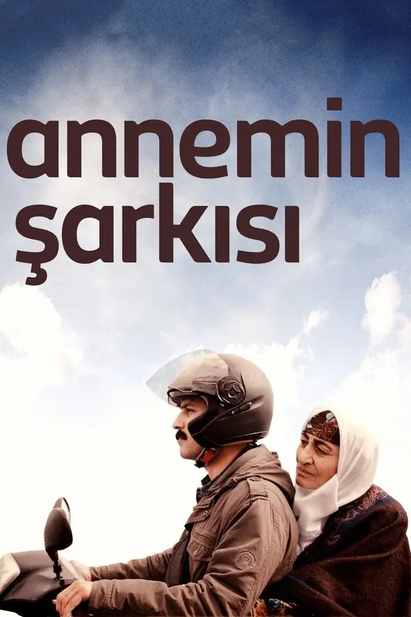 Annemin Şarkısı filminin afişi: açık mavi gökyüzü altında kasklı genç bir adam motosiklet sürüyor, arkasında beyaz başörtülü yaşlı annesi oturuyor; üstte annemin şarkısı yazısı