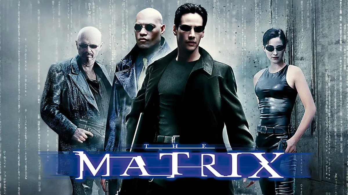 Matrix filminin tanıtım görseli: yeşil kod yağmuru akan gri duvarın önünde siyah deri kıyafetli ve güneş gözlüklü Cypher, Morpheus, Neo ve Trinity; altta mavi harflerle MATRIX yazısı