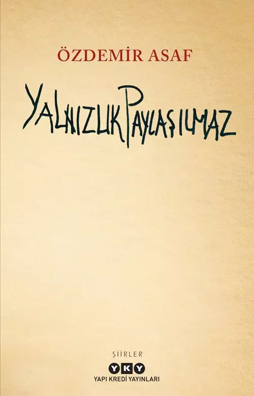 Özdemir Asaf’ın Yalnızlık Paylaşılmaz kitabının kapağı; eskimiş kâğıt dokulu bej zemin üzerinde el yazısıyla kitabın adı