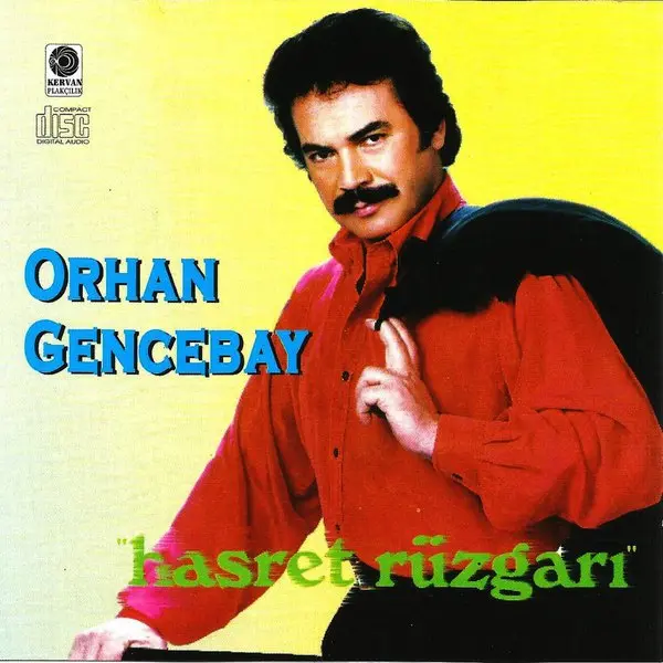 Orhan Gencebay’ın Hasret Rüzgarı albüm kapağı; sarı zemin önünde kırmızı ceketli Orhan Gencebay