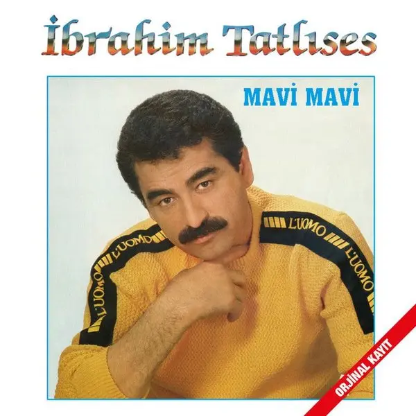 İbrahim Tatlıses’in Mavi Mavi albüm kapağı; sarı tişörtlü, bıyıklı İbrahim Tatlıses’in mavi çerçeveli portresi ve üstte kırmızı harflerle adı