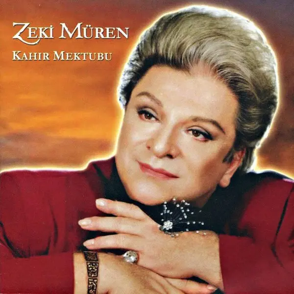 Zeki Müren’in Kahır Mektubu albüm kapağı; kırmızı ceketiyle kollarını kavuşturup gülümseyen Zeki Müren